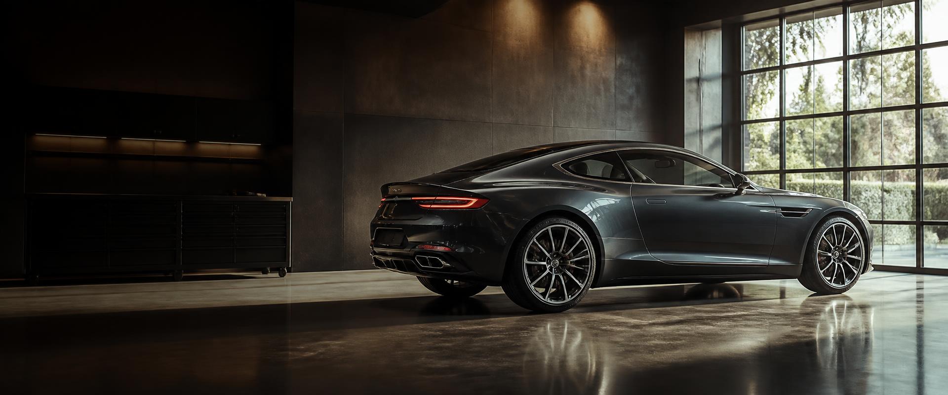 Premium pearl-gray grand tourer coupe with flawless glossy paint in an upscale auto body showroom, lit by warm directional light